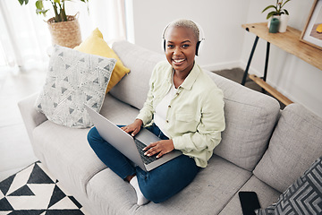 Image showing Portrait of black woman, remote work or laptop on sofa in living room for online research in headphones. Happy, top view or journalist working on computer for streaming or social media blog at home