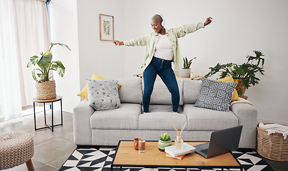 Image showing Dance, black woman and listening to music on the sofa for freedom, the radio or an audio. House, streaming or African girl with headphones for a podcast, playlist or enjoying a song on the couch