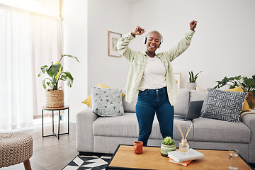 Image showing Dance, black woman and listening to music in the living room for freedom, the radio or an audio. Happy, streaming or African girl with headphones for a podcast, playlist or enjoying a song in a house