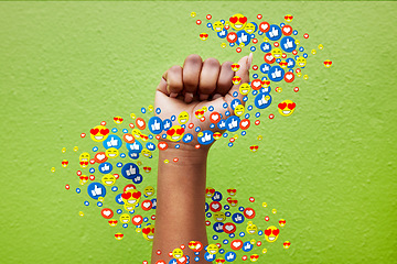 Image showing Hand, social media and emoji with a person in protest on green background for politics, power or strength. Fist, like and reaction with an adult in studio for a digital app emoticon for communication