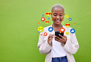 Image showing Phone icon, black woman and social media emojis of heart, thumbs up and smile for mockup advertising space. Cellphone, like opinion notification and user typing communication on green background wall