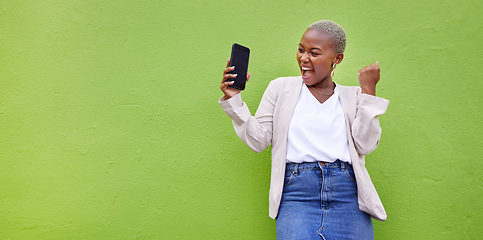 Image showing Woman, celebrate and phone screen with mockup by a wall or green background with wow advertising. Excited African person or winner with a smartphone for competition, promotion or website banner space