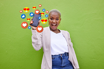Image showing Portrait, excited black woman and phone emojis, social media icons and thumbs up notification. Smartphone communication, like opinion vote and African user show feedback on green background wall