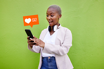 Image showing Surprise, black woman and phone heart icon, social network emoji and reading love feedback, sms notification or mobile app. Wow opinion, cellphone media post or shocked user on green background wall