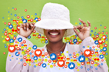 Image showing Social media, smile and emoji icon of woman influencer for like or love reaction. Person hiding under hat for fan page, content creator app or communication notification overlay on green background