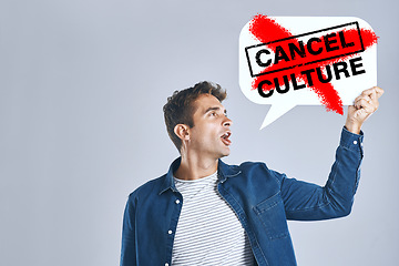 Image showing Cancel culture, speech bubble and man with voice for support, censorship and opinion on grey background in studio. Poster, ban and social media influencer for freedom of vote, politics and propaganda