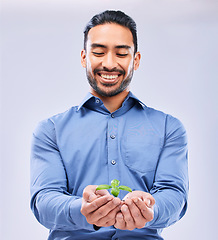 Image showing Corporate, sustainability and businessman happy with NGO or agro growth isolated in a studio white background. Palm, startup and entrepreneur with soil and plant as an investment or climate change