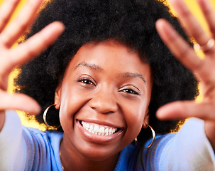 Image showing Black woman, portrait and high five frame of hands with smile on yellow background in studio in Africa. Happiness, person and afro for freedom, lifestyle and inspiration with skin glow in Kenya