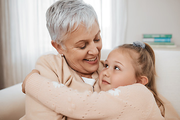 Image showing Love, couch, and child hug grandmother in a home for bonding, care and relax together for travel or road trip. Senior, sofa and elderly person or grandparent with girl kid as family on retirement