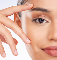 Image showing Half face, closeup and woman with skincare, beauty or dermatology on a studio background. Portrait, person or model with grooming routine, luxury or wellness with facial, shine or glow with cosmetics