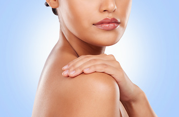 Image showing Beauty, skincare and shoulder of woman on blue background for wellness, satisfaction and healthy skin. Luxury spa, aesthetic and closeup of person in studio for dermatology, cosmetics and self care