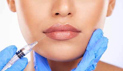 Image showing Injection, woman and lips in studio for plastic surgery, beauty process and aesthetic filler on white background. Closeup, mouth and needle from surgeon for facial change, skincare and prp cosmetics