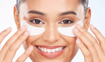 Image showing Skincare, portrait and happy woman with eye patch for anti aging luxury skin glow on white background. Cosmetics, facial mask and face of model with solution or collagen pad for dermatology in studio