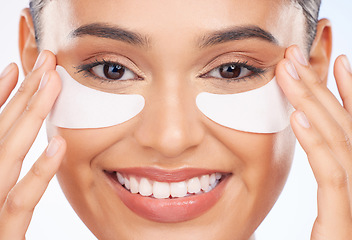 Image showing Skincare, beauty and happy woman with collagen pad for anti aging or skin glow on white background. Cosmetics, facial detox and face of model with solution or eye product for dermatology in studio.