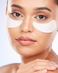 Image showing Skincare, beauty and portrait of woman with collagen eye patch for anti aging or skin pad on white background. Cosmetics, facial detox and model with luxury mask or product for dermatology in studio.