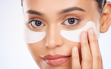 Image showing Portrait, beauty and woman with eye pads for anti aging or skin glow on studio background. Cosmetics, facial detox and face of model with solution or collagen skincare patch for dermatology product.