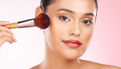 Image showing Beauty, makeup and portrait of woman in studio with a brush for cheek blush or foundation for glam routine. Cosmetics, face and young female model with cosmetology product isolated by pink background