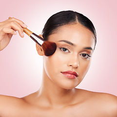 Image showing Cosmetic, makeup brush and portrait of woman in studio with a glamour, beauty or face routine. Glow, self care and headshot of young female model with cosmetology product isolated by pink background.