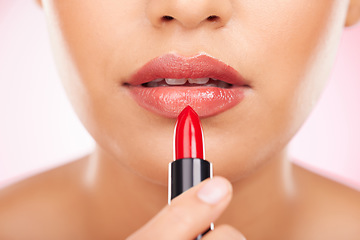 Image showing Makeup, mouth and woman with lipstick in studio for application, cosmetic and gloss closeup. Zoom, beauty and female model with color treatment for plump, volume and smooth lips texture promotion