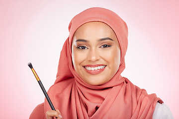 Image showing Beauty, portrait and muslim woman with makeup brush in studio for wellness and cosmetics on pink background. Halal skincare, face and female with hijab for luxury, glamour or Islamic safe products