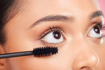 Image showing Mascara brush, eyes and face of woman with studio cosmetics tools, skincare wellness and grooming lashes. Closeup, salon cosmetology or self care person with eyelash makeup product on pink background