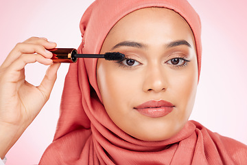 Image showing Mascara brush, portrait or Islamic woman with studio cosmetic tools, skincare or grooming facial lashes. Eyelash product application, spa salon or hijab face of Arabic Muslim model on pink background