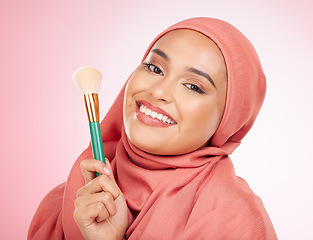 Image showing Smile, portrait and a Muslim woman with a brush for makeup on a pink background. Happy, skincare and an Islamic model with a product for cosmetics, skincare or a product for applying foundation