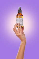 Image showing Hand, oil or spray with beauty and skincare, advertising product with dermatology isolated on purple background. Wellness, cosmetics for skin toner and promotion, bottle and hyaluronic acid in studio