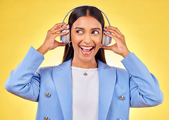 Image showing Headphones, excited or businesswoman streaming music thinking of podcast on yellow background. Happy, smile or entrepreneur listening to radio song or audio sound on subscription playlist in studio