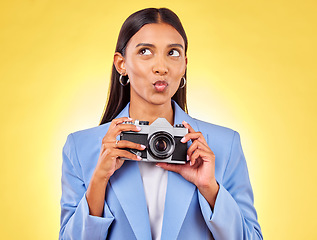 Image showing Pouting, thinking and a woman with a camera on a yellow background for a photography idea. Happy, photographer or a person with gear for paparazzi, press or a journalist employee for pictures