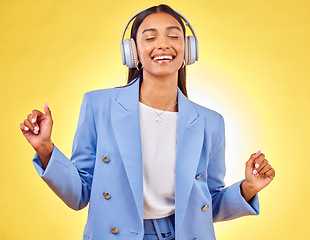 Image showing Dance, relax or happy woman streaming music in headphones on yellow background. Relax, smile or calm entrepreneur listening to radio song, album or audio sound on subscription playlist in studio