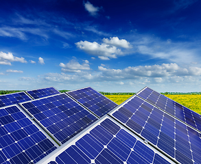 Image showing Solar battery panels in rural meadow field