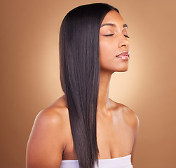 Image showing Beauty, straight hair and skincare with face of woman in studio for keratin, salon treatment and texture. Shampoo, health and growth with model on brown background for glamour, shine and hairstyle