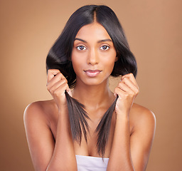 Image showing Beauty, hair care and texture with portrait of woman in studio for keratin, salon treatment and cosmetics. Shampoo, health and growth with model on brown background for glamour, shine or hairstyle