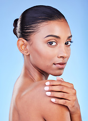 Image showing Woman, natural beauty and skincare portrait with relax, face cleaning and skin glow in studio. Facial, female model and cosmetics with dermatology care and collagen treatment with blue background