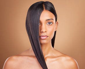 Image showing Beauty, hair and cosmetics with portrait of woman in studio for keratin, salon treatment and texture. Shampoo, health and growth with face of model on brown background for glamour, shine or hairstyle