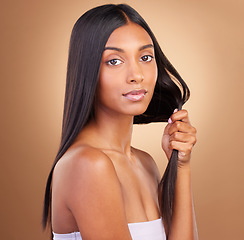 Image showing Beauty, hair and health with portrait of woman in studio for keratin, salon treatment and texture. Shampoo, cosmetics and growth with face of model on brown background for glamour, shine or hairstyle