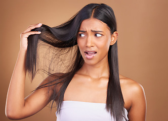 Image showing Beauty, disaster and unhappy woman with hair loss in studio worry, stress or anxiety for damage on brown background. Haircare, fail and lady model with dry scalp mistake, dandruff or alopecia crisis