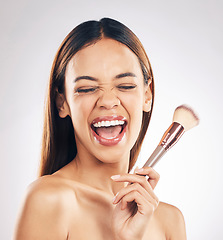 Image showing Woman, excited with brush for makeup, beauty and happiness with foundation isolated on white background. Powder, cosmetics tools and skincare with shine, positivity and smile for skin glow in studio