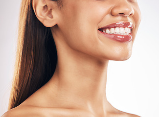 Image showing Woman, face and teeth whitening with smile, dental and health, skin and lip gloss on white background. Mouth wellness, oral healthcare and orthodontics, veneers and makeup, cosmetic care in studio