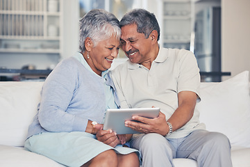 Image showing Happy, tablet and senior couple streaming movie or show with love, care and bonding in home living room together. Couch, app and elderly people relax and watching a subscription service on retirement