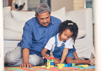 Image showing Grandfather, building blocks and home with a kid and playing for development with family. Grandpa, young girl and living room floor together with care, support and youth game in a house with help