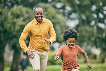 Image showing African father, son and running in park, funny game and speed with freedom, care and love on holiday. Black man, young boy and comic playing with smile, outdoor and happy in summer sunshine on lawn