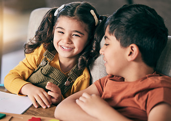 Image showing Girl, boy and siblings in home, learning and smile with book, toys and education at desk for development. Happy family, children and together with notebook, studying and playful with bonding in house