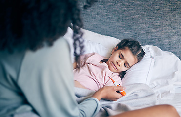 Image showing Mother, thermometer and sick child in bed with illness, virus or infection and caring parent at home. Mom checking kid or little girl with fever, cold or flu in health or medical attention in bedroom