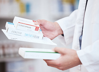 Image showing Pharmacist hands, pharmacy medicine and allergy product of healthcare, expert choice and product in store. Medical worker, doctor or person with boxes of pills, retail drugs or tablet in clinic stock