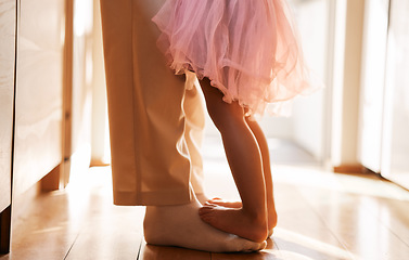 Image showing Dance, learning and feet of father and daughter for ballet, support and love. Music, help and youth with closeup of man and young girl in family home for teaching, creative and princess together