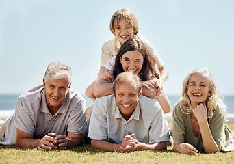 Image showing Happy family, picnic and grandparents with child and parents on tropical vacation or outdoor holiday for bonding. Portrait, smile and kid with grandfather travel with mother, father and grandmother