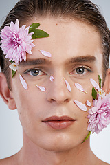Image showing Natural, skincare and flowers with portrait of man in studio for spring, beauty cosmetics and creative. Glow, non binary and floral with face of model on white background for makeup, spa and wellness