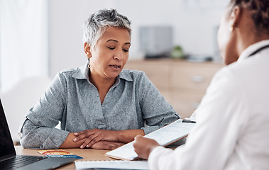 Image showing Paperwork, doctor or consulting a patient in meeting talking in hospital for history or healthcare record. People, medical info or nurse with mature woman speaking of test results, update or document